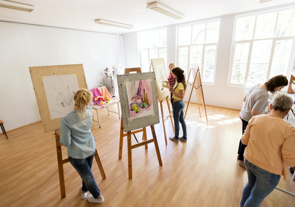 woman-artists-with-brushes-painting-at-art-school.jpg